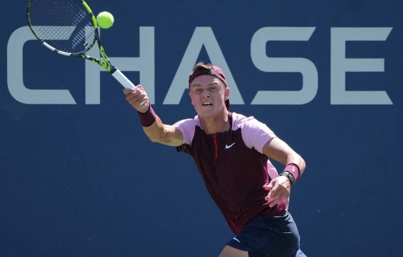 Aug 30, 2022; Flushing, NY, USA; Holger Rune of Denmark hits a shot against Peter Gojowczyk of Germany on day two of the 2022 U.S. Open tennis tournament at USTA Billie Jean King National Tennis Center. Mandatory Credit: Jerry Lai-USA TODAY Sports