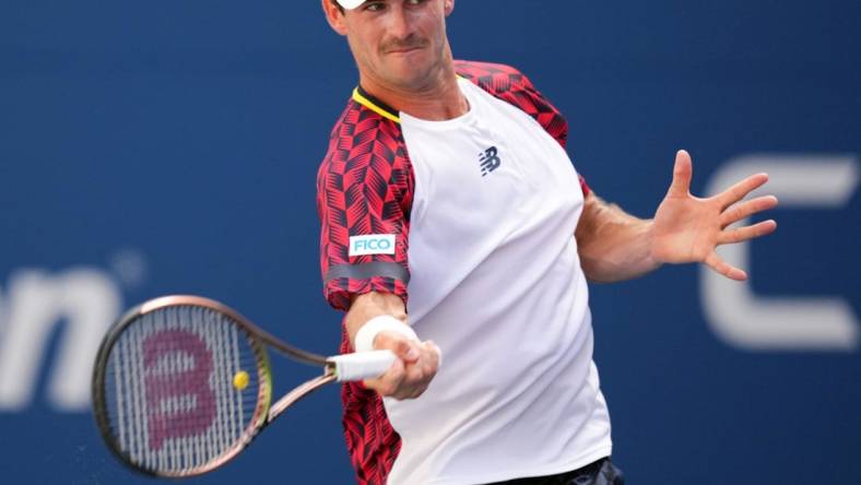 Sep 2, 2022; Flushing, NY, USA; Tommy Paul of the United States hits to Casper Ruud of Norway on day five of the 2022 U.S. Open tennis tournament at USTA Billie Jean King Tennis Center. Mandatory Credit: Danielle Parhizkaran-USA TODAY Sports