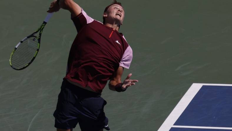 Sep 3, 2022; Flushing, NY, USA; Holger Rune (DEN) serves against Cameron Norrie (GBR) (not pictured) on day six of the 2022 U.S. Open tennis tournament at USTA Billie Jean King Tennis Center. Mandatory Credit: Geoff Burke-USA TODAY Sports