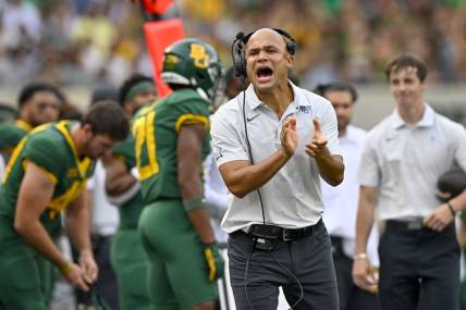 Sep 3, 2022; Waco, Texas, USA; Baylor Bears head coach Dave Aranda cheers for this team during the first quarter against the Albany Great Danes at McLane Stadium. Mandatory Credit: Jerome Miron-USA TODAY Sports