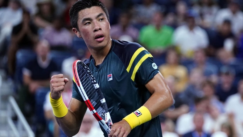 Sep 3, 2022; Flushing, NY, USA; Brandon Nakashima of the United States reacts after winning the first set against Jannik Sinner of Italy on day six of the 2022 U.S. Open tennis tournament at USTA Billie Jean King Tennis Center. Mandatory Credit: Danielle Parhizkaran-USA TODAY Sports
