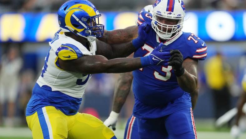 Sep 8, 2022; Inglewood, California, USA; Los Angeles Rams linebacker Leonard Floyd (54) defends against  Buffalo Bills offensive tackle Dion Dawkins (73) in the second quarter at SoFi Stadium. Mandatory Credit: Kirby Lee-USA TODAY Sports