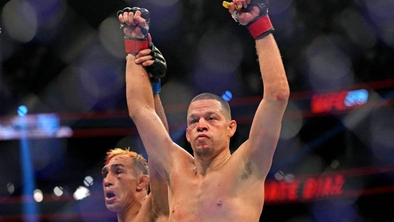 Sep 10, 2022; Las Vegas, Nevada, USA; Nate Diaz (red gloves) fights Tony Ferguson (blue gloves) during UFC 279 at T-Mobile Arena. Mandatory Credit: Joe Camporeale-USA TODAY Sports