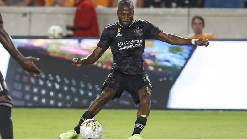 Sep 13, 2022; Houston, Texas, USA; Houston Dynamo FC midfielder Fafa Picault (10) kicks the ball during the second half against the New England Revolution at PNC Stadium. Mandatory Credit: Troy Taormina-USA TODAY Sports