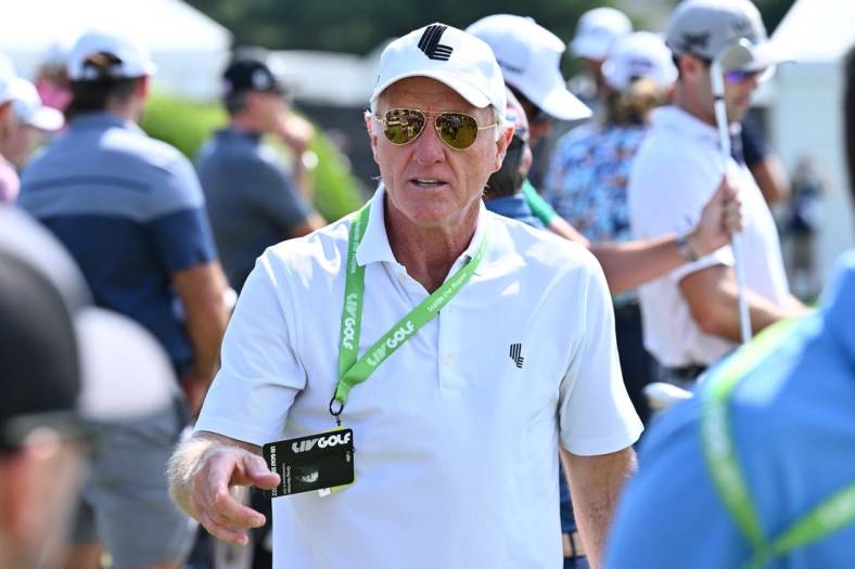 Sep 17, 2022; Chicago, Illinois, USA; Greg Norman greets people on the driving range before the second round of the Invitational Chicago LIV Golf tournament at Rich Harvest Farms. Mandatory Credit: Jamie Sabau-USA TODAY Sports