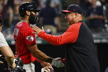 Sep 17, 2022; Cleveland, Ohio, USA; Cleveland Guardians shortstop Amed Rosario celebrates with manager Terry Francona, right, after hitting an RBI single to win the game during the fifteenth inning against the Minnesota Twins at Progressive Field. Mandatory Credit: Ken Blaze-USA TODAY Sports