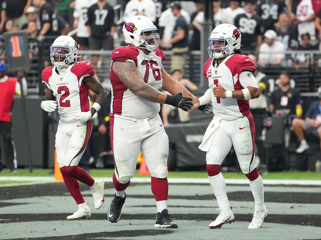 Sep 18, 2022; Paradise, Nevada, USA; Arizona Cardinals quarterback Kyler Murray (1) celebrates with Arizona Cardinals guard Will Hernandez (76) after scoring a rushing touchdown against the Las Vegas Raiders at Allegiant Stadium. Mandatory Credit: Stephen R. Sylvanie-USA TODAY Sports