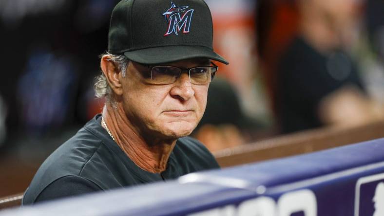 Sep 19, 2022; Miami, Florida, USA; Miami Marlins manager Don Mattingly (8) watches from the dugout during the first inning against the Chicago Cubs at loanDepot Park. Mandatory Credit: Sam Navarro-USA TODAY Sports