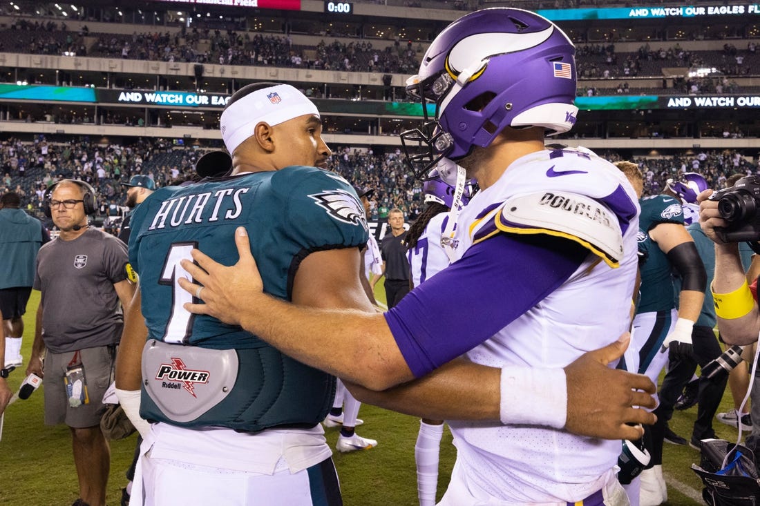 Sep 19, 2022; Philadelphia, Pennsylvania, USA; Philadelphia Eagles quarterback Jalen Hurts (1) and Minnesota Vikings quarterback Kirk Cousins (8) meet on the field after the game at Lincoln Financial Field. Mandatory Credit: Bill Streicher-USA TODAY Sports