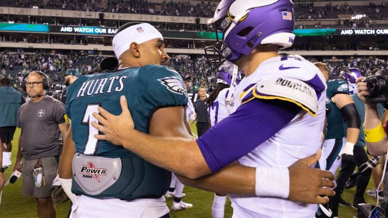 Sep 19, 2022; Philadelphia, Pennsylvania, USA; Philadelphia Eagles quarterback Jalen Hurts (1) and Minnesota Vikings quarterback Kirk Cousins (8) meet on the field after the game at Lincoln Financial Field. Mandatory Credit: Bill Streicher-USA TODAY Sports