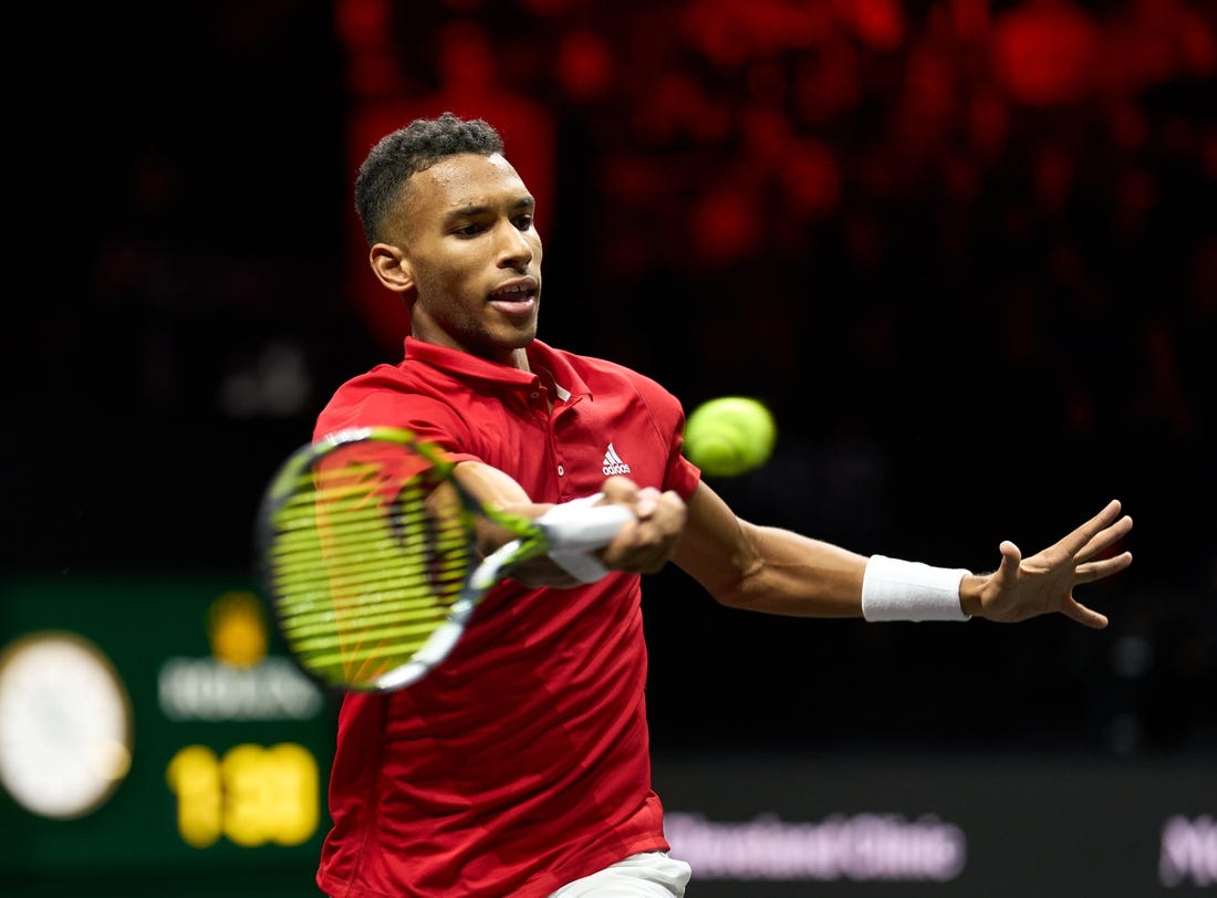 Sep 25, 2022; London, United Kingdom; Felix Auger-Aliassime (CAN) plays a shot against Novak Djokovic (SRB) in Lavers Cup singles. Mandatory Credit: Peter van den Berg-USA TODAY Sports