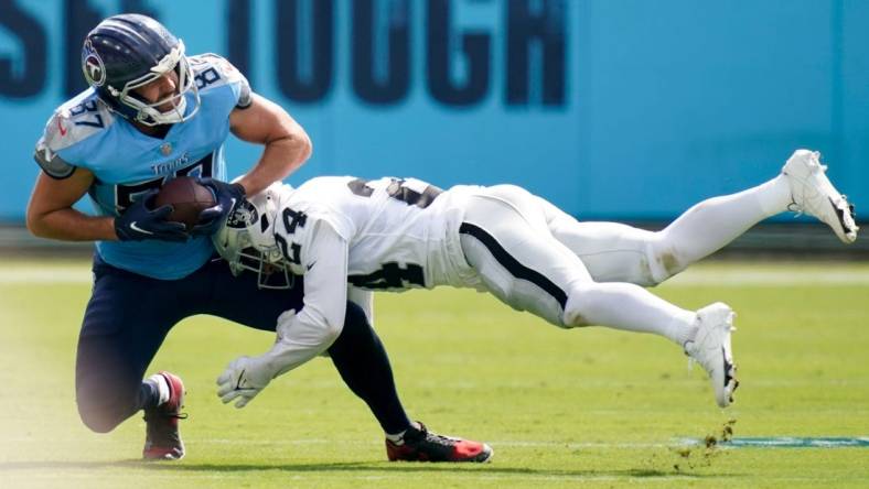 Las Vegas Raiders safety Johnathan Abram (24) tackles Tennessee Titans tight end Geoff Swaim (87) during the second quarter at Nissan Stadium Sunday, Sept. 25, 2022, in Nashville, Tenn.

Nfl Las Vegas Raiders At Tennessee Titans