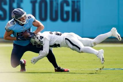 Las Vegas Raiders safety Johnathan Abram (24) tackles Tennessee Titans tight end Geoff Swaim (87) during the second quarter at Nissan Stadium Sunday, Sept. 25, 2022, in Nashville, Tenn.

Nfl Las Vegas Raiders At Tennessee Titans
