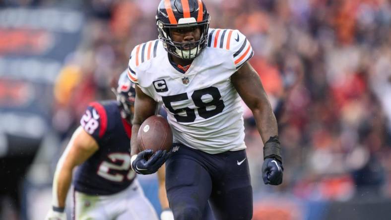 Sep 25, 2022; Chicago, Illinois, USA; Chicago Bears inside linebacker Roquan Smith (58) runs with the ball after an interception in the fourth quarter against the Houston Texans at Soldier Field. Mandatory Credit: Daniel Bartel-USA TODAY Sports