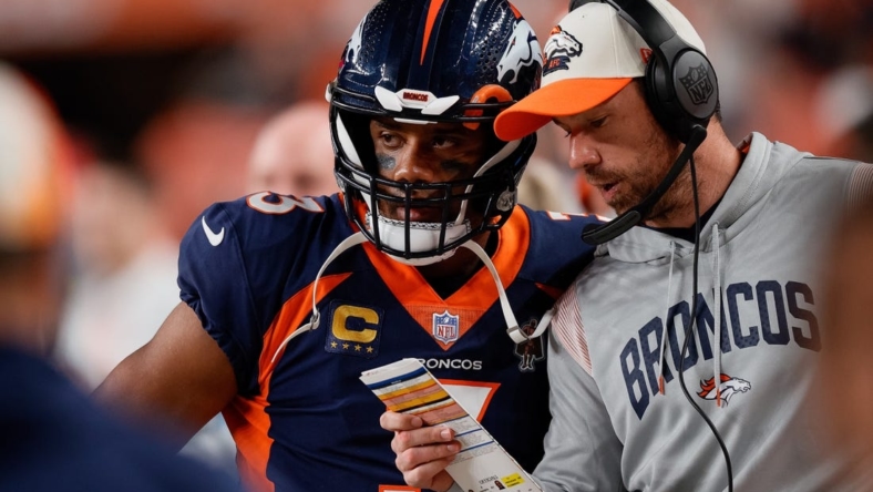 Sep 25, 2022; Denver, Colorado, USA; Denver Broncos quarterback Russell Wilson (3) talks with quarterbacks coach Klint Kubiak in the second quarter against the San Francisco 49ers at Empower Field at Mile High. Mandatory Credit: Isaiah J. Downing-USA TODAY Sports