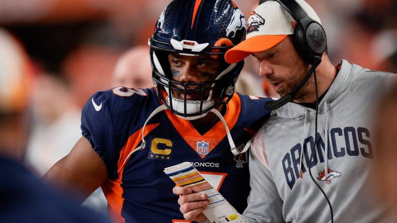 Sep 25, 2022; Denver, Colorado, USA; Denver Broncos quarterback Russell Wilson (3) talks with quarterbacks coach Klint Kubiak in the second quarter against the San Francisco 49ers at Empower Field at Mile High. Mandatory Credit: Isaiah J. Downing-USA TODAY Sports