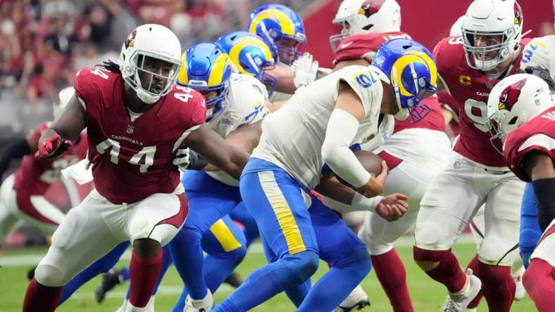 Sep 25, 2022; Glendale, Ariz., U.S.;  Los Angeles Rams quarterback Matthew Stafford (9) is sacked by Arizona Cardinals linebacker Markus Golden (44) and defensive end J.J. Watt (99) during the third quarter at State Farm Stadium.

Nfl Los Angeles Rams At Arizona Cardinals