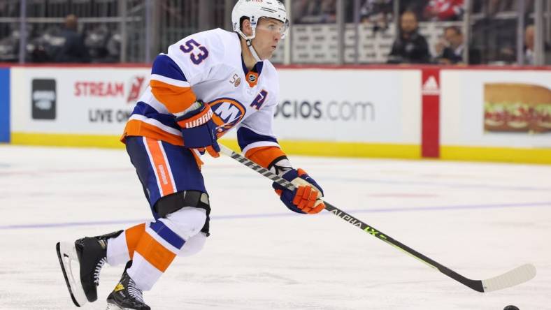 Sep 27, 2022; Newark, New Jersey, USA; New York Islanders center Casey Cizikas (53) skates with the puck against the New Jersey Devils during the third period at Prudential Center. Mandatory Credit: Ed Mulholland-USA TODAY Sports