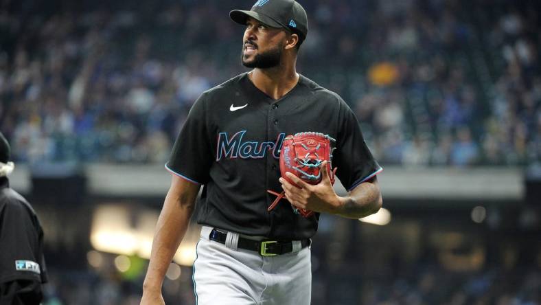 Sep 30, 2022; Milwaukee, Wisconsin, USA; Miami Marlins starting pitcher Sandy Alcantara (22) walks off the field against the Milwaukee Brewers after the seventh inning at American Family Field. Mandatory Credit: Michael McLoone-USA TODAY Sports