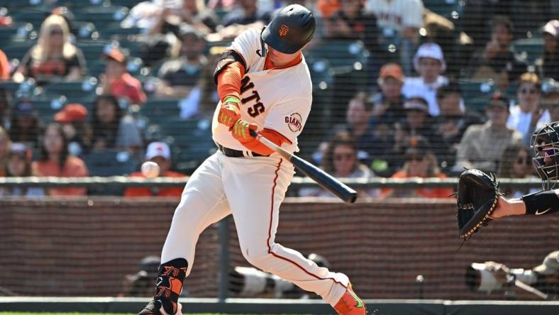 Oct 1, 2022; San Francisco, California, USA; San Francisco Giants right fielder Joc Pederson (23) hits a single against the Arizona Diamondbacks during the third inning at Oracle Park. Mandatory Credit: Robert Edwards-USA TODAY Sports