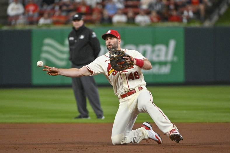 Oct 1, 2022; St. Louis, Missouri, USA; St. Louis Cardinals first baseman Paul Goldschmidt (46) throws from his knees against the Pittsburgh Pirates during the third inning at Busch Stadium. Mandatory Credit: Jeff Curry-USA TODAY Sports