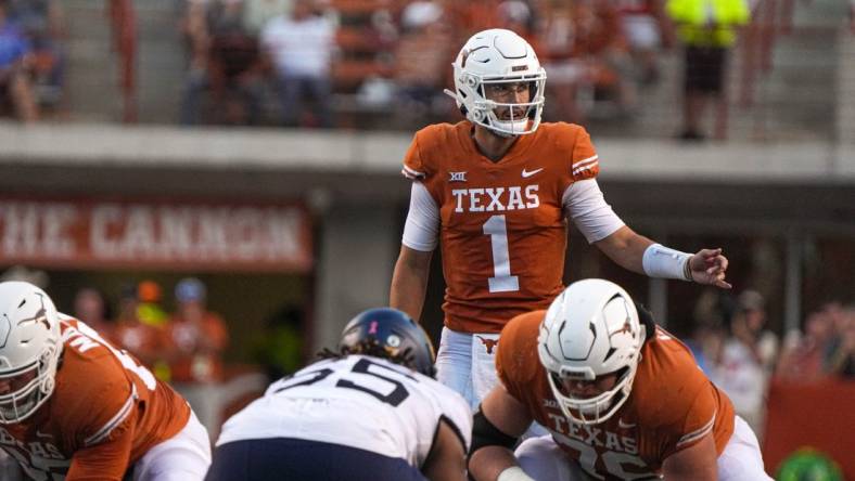 Oct 1, 2022; Austin, Texas, USA; Texas Longhorns quarterback Hudson Card (1) directs the Longhorns offense during a game against the West Virginia Mountaineers at Royal Memorial Stadium. Mandatory Credit: Aaron E. Martinez/American-Statesman via USA TODAY NETWORK