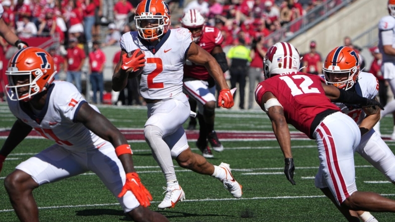 Illinois running back Chase Brown (2) finds a seam during the third quarter of their game Saturday, October 1, 2022 at Camp Randall Stadium in Madison, Wis. Illinois beat Wisconsin 34-10.

Uwgrid01 15