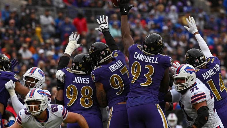 Oct 2, 2022; Baltimore, Maryland, USA;  Buffalo Bills place kicker Tyler Bass (2) first half field goal clears Baltimore Ravens defensive tackle Calais Campbell (93)  tented hand during at M&T Bank Stadium. Mandatory Credit: Tommy Gilligan-USA TODAY Sports