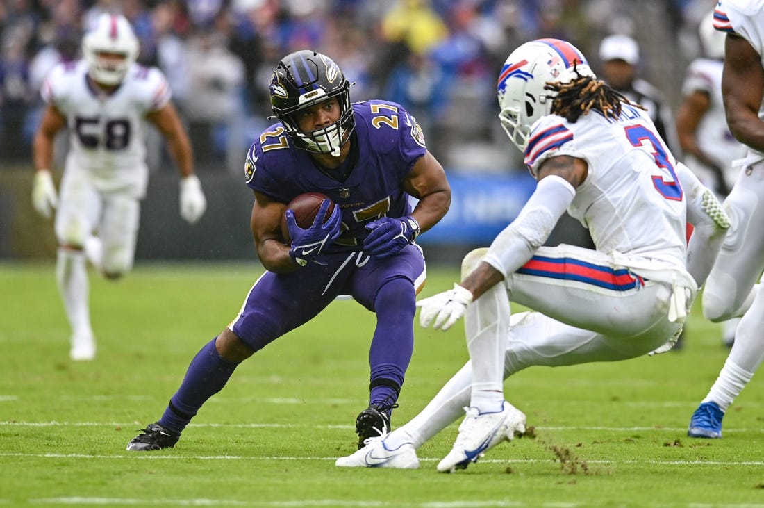 Oct 2, 2022; Baltimore, Maryland, USA;  Baltimore Ravens running back J.K. Dobbins (27) cuts in front of Buffalo Bills safety Damar Hamlin (3) during the second quarter at M&T Bank Stadium. Mandatory Credit: Tommy Gilligan-USA TODAY Sports