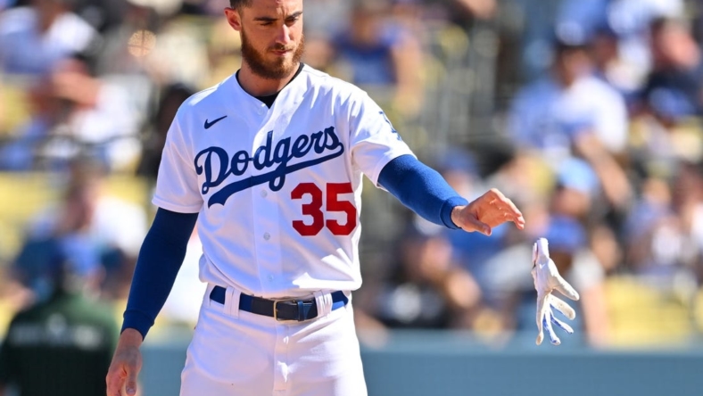 Oct 2, 2022; Los Angeles, California, USA; Los Angeles Dodgers center fielder Cody Bellinger (35) tosses his batting gloves after striking out in the fifth inning against the Colorado Rockies at Dodger Stadium. Mandatory Credit: Jayne Kamin-Oncea-USA TODAY Sports
