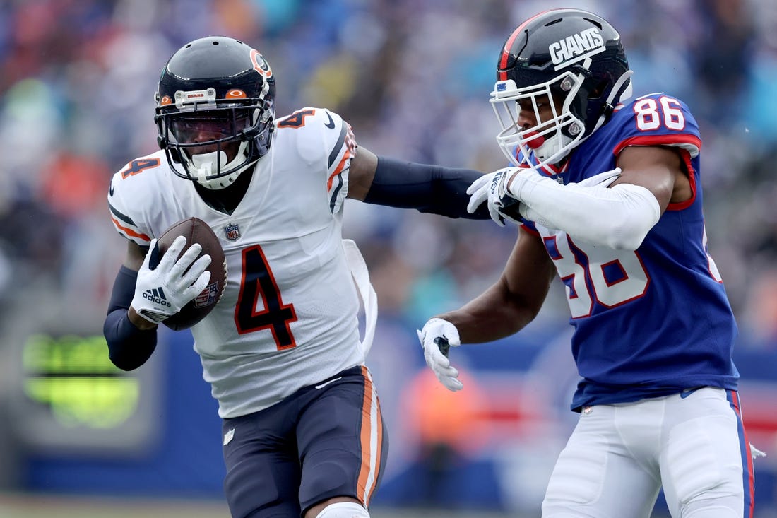 Oct 2, 2022; East Rutherford, New Jersey, USA; Chicago Bears safety Eddie Jackson (4) intercepts a pass intended for New York Giants wide receiver Darius Slayton (86) during the fourth quarter at MetLife Stadium. Mandatory Credit: Brad Penner-USA TODAY Sports