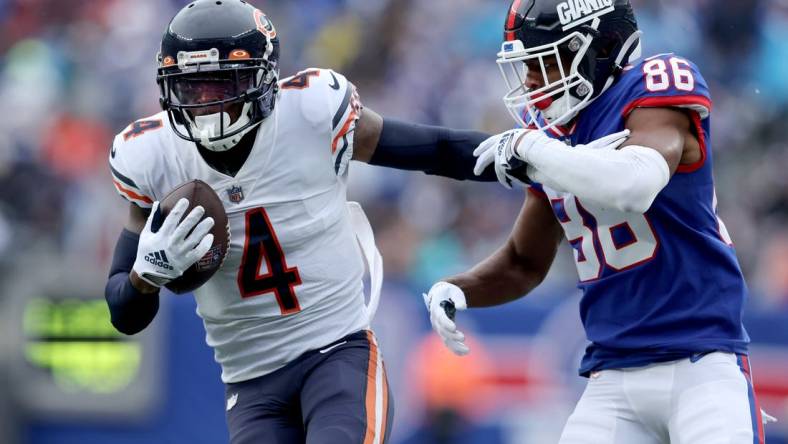 Oct 2, 2022; East Rutherford, New Jersey, USA; Chicago Bears safety Eddie Jackson (4) intercepts a pass intended for New York Giants wide receiver Darius Slayton (86) during the fourth quarter at MetLife Stadium. Mandatory Credit: Brad Penner-USA TODAY Sports