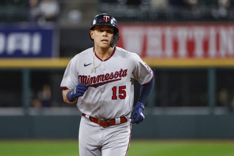 Oct 3, 2022; Chicago, Illinois, USA; Minnesota Twins third baseman Gio Urshela (15) rounds the bases after hitting a two-run home run against the Chicago White Sox during the first inning at Guaranteed Rate Field. Mandatory Credit: Kamil Krzaczynski-USA TODAY Sports