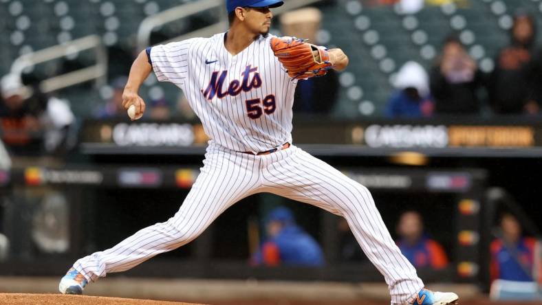 Oct 4, 2022; New York City, New York, USA; New York Mets starting pitcher Carlos Carrasco (59) pitches against the Washington Nationals during the first inning at Citi Field. Mandatory Credit: Brad Penner-USA TODAY Sports