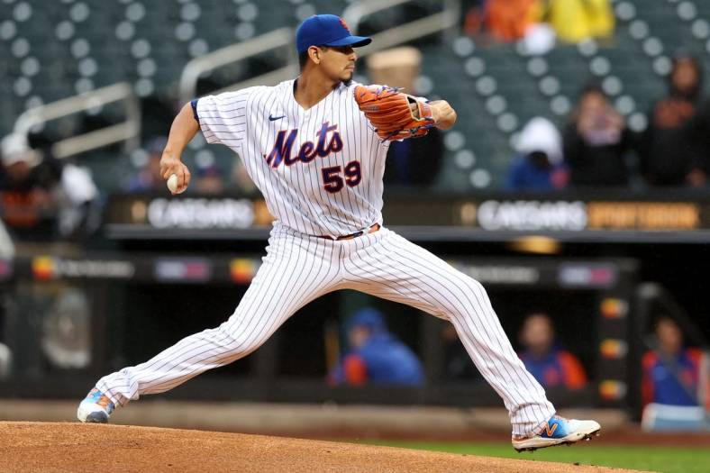 Oct 4, 2022; New York City, New York, USA; New York Mets starting pitcher Carlos Carrasco (59) pitches against the Washington Nationals during the first inning at Citi Field. Mandatory Credit: Brad Penner-USA TODAY Sports