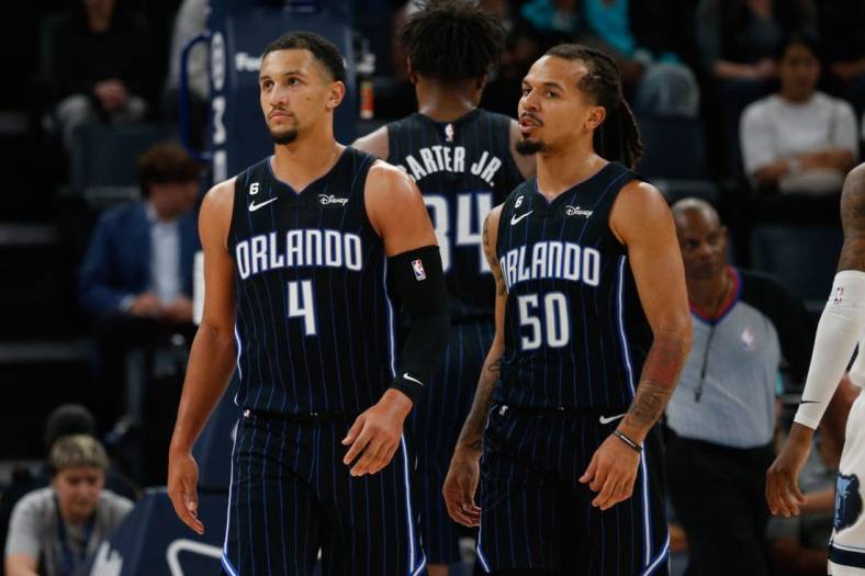 Oct 3, 2022; Memphis, Tennessee, USA; Orlando Magic guard Jalen Suggs (4) and guard Cole Anthony (50) walk to the bench during a timeout during the first half against the Memphis Grizzlies at FedExForum. Mandatory Credit: Petre Thomas-USA TODAY Sports
