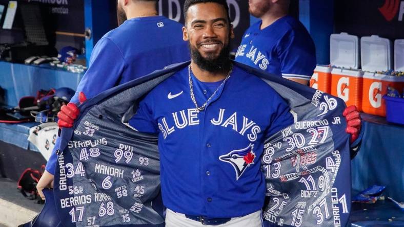 Oct 8, 2022; Toronto, Ontario, CAN; Toronto Blue Jays right fielder Teoscar Hernandez (37) celebrates in the dugout after hitting a solo home run in the fourth inning against the Seattle Mariners during game two of the Wild Card series for the 2022 MLB Playoffs at Rogers Centre. Mandatory Credit: John E. Sokolowski-USA TODAY Sports