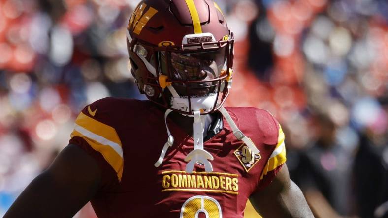 Oct 9, 2022; Landover, Maryland, USA; Washington Commanders running back Brian Robinson (8) stands on the field during warmup prior to the Commanders' game against the Tennessee Titans at FedExField. Mandatory Credit: Geoff Burke-USA TODAY Sports