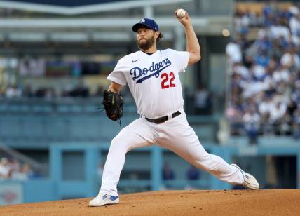 Oct 12, 2022; Los Angeles, California, USA; Los Angeles Dodgers starting pitcher Clayton Kershaw (22) throws in the first inning of game two of the NLDS for the 2022 MLB Playoffs against the San Diego Padres at Dodger Stadium. Mandatory Credit: Kiyoshi Mio-USA TODAY Sports