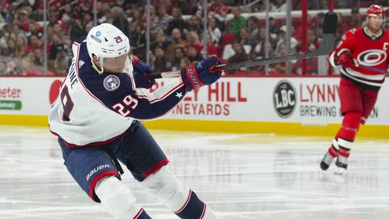 Oct 12, 2022; Raleigh, North Carolina, USA; Columbus Blue Jackets left wing Patrik Laine (29) scores a goal on his shot against the Carolina Hurricanes during the first period at PNC Arena. Mandatory Credit: James Guillory-USA TODAY Sports