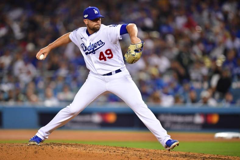 Oct 12, 2022; Los Angeles, California, USA; Los Angeles Dodgers relief pitcher Blake Treinen (49) throws during the eighth inning of game two of the NLDS for the 2022 MLB Playoffs against the San Diego Padres at Dodger Stadium. Mandatory Credit: Gary A. Vasquez-USA TODAY Sports