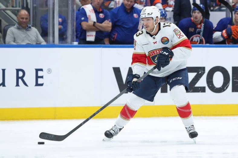 Oct 13, 2022; Elmont, New York, USA;   Florida Panthers center Sam Reinhart (13) controls the puck during the first period against the New York Islanders at UBS Arena. Mandatory Credit: Thomas Salus-USA TODAY Sports