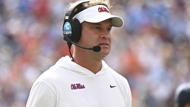 Oct 15, 2022; Oxford, Mississippi, USA; Mississippi Rebels head coach Lane Kiffin walks off the field during a timeout during the first quarter of the game against the Auburn Tigers at Vaught-Hemingway Stadium. Mandatory Credit: Matt Bush-USA TODAY Sports