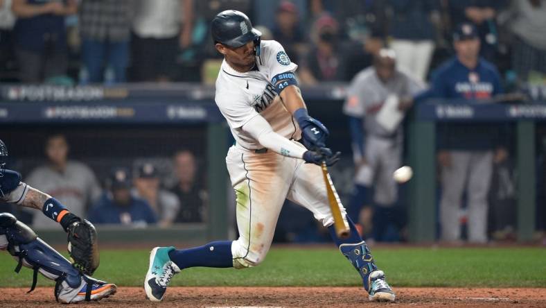 Oct 15, 2022; Seattle, Washington, USA; Seattle Mariners center fielder Julio Rodriguez (44) pops out to end the game in the eighteenth inning against the Houston Astros during game three of the ALDS for the 2022 MLB Playoffs at T-Mobile Park. Mandatory Credit: Steven Bisig-USA TODAY Sports