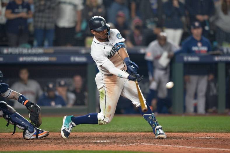 Oct 15, 2022; Seattle, Washington, USA; Seattle Mariners center fielder Julio Rodriguez (44) pops out to end the game in the eighteenth inning against the Houston Astros during game three of the ALDS for the 2022 MLB Playoffs at T-Mobile Park. Mandatory Credit: Steven Bisig-USA TODAY Sports