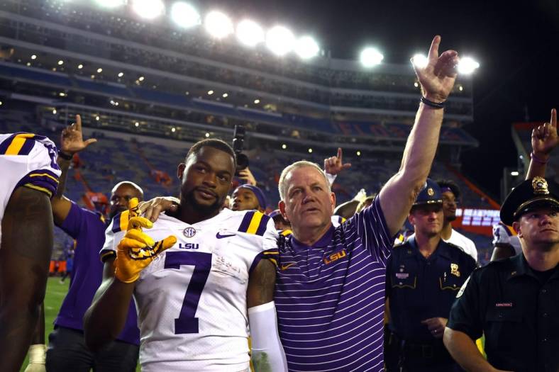 Oct 15, 2022; Gainesville, Florida, USA; LSU Tigers wide receiver Kayshon Boutte (7) and head coach Brian Kelly celebrate after they beat the Florida Gators  at Ben Hill Griffin Stadium. Mandatory Credit: Kim Klement-USA TODAY Sports