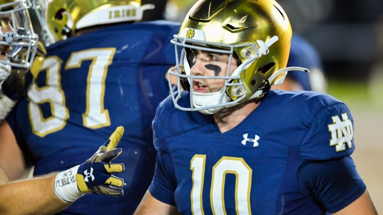 Oct 15, 2022; South Bend, Indiana, USA; Notre Dame Fighting Irish quarterback Drew Pyne (10) reacts after a touchdown in the third quarter against the Stanford Cardinal at Notre Dame Stadium. Mandatory Credit: Matt Cashore-USA TODAY Sports