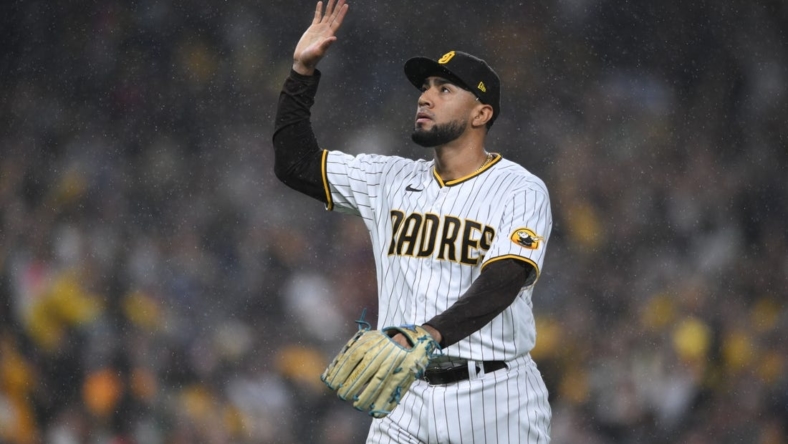 Oct 15, 2022; San Diego, California, USA;San Diego Padres relief pitcher Robert Suarez (75) celebrates a a strike out in the eighth inning against the Los Angeles Dodgers during game four of the NLDS for the 2022 MLB Playoffs at Petco Park. Mandatory Credit: Orlando Ramirez-USA TODAY Sports