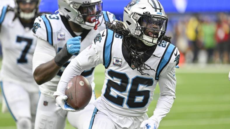 Oct 16, 2022; Inglewood, California, USA; Carolina Panthers cornerback Donte Jackson (26) returns an interception for 30 yards and a touchdown in the second quarter against the Los Angeles Rams at SoFi Stadium. Mandatory Credit: Robert Hanashiro-USA TODAY Sports