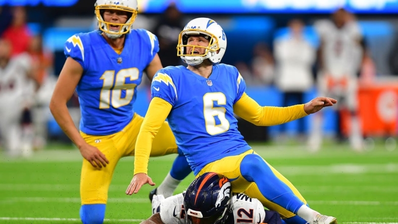 Oct 17, 2022; Inglewood, California, USA; Los Angeles Chargers place kicker Dustin Hopkins (6) kicks the game winning field goal against the Denver Broncos during overtime at SoFi Stadium. Mandatory Credit: Gary A. Vasquez-USA TODAY Sports